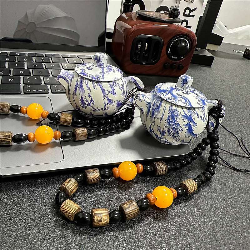 Blue and white porcelain teapot lighter with pink flame, refillable lighter